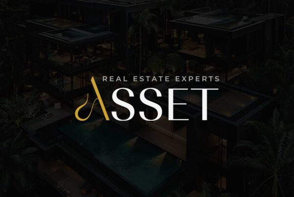 Asset real estate brand logo applied over luxury modern villas at night, highlighting premium positioning and architectural focus